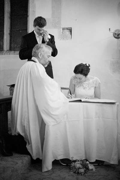 emotional groom sign register