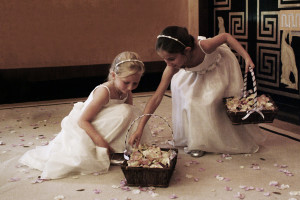 flower girls refill their confetti baskets with rose petals at Eltham palace.